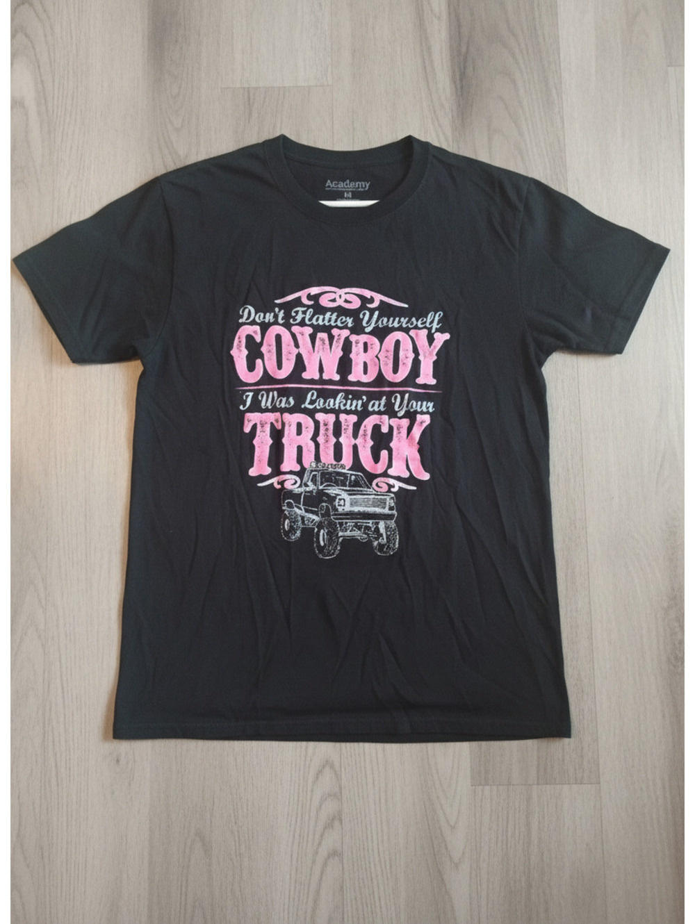 Academy Black Graphic T-Shirt with Pink Cowboy Truck Design, Size Medium